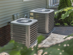 heating and air conditioning units in the backyard of a home