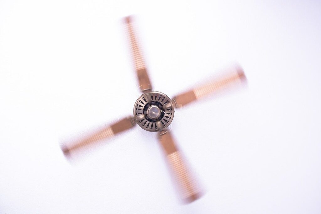 brown ceiling fan spinning fast