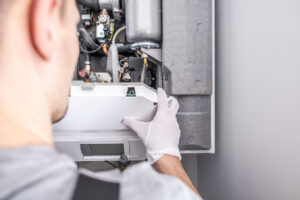 %Focuskw% | Grapids Home Services HVAC technician repairing a furnace