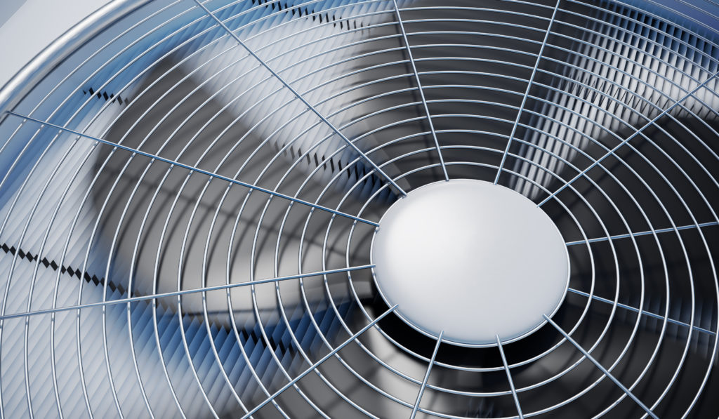 Close up view on HVAC unit fan spinning - prepare your ac these 5 ways