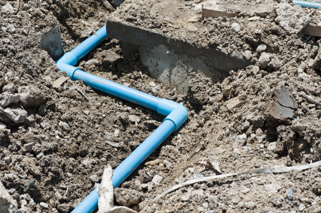 sewer line installed in the yard of someone's home
