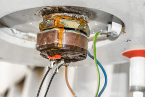 %Focuskw% | Grapids Home Services closeup of a rusty and leaking water heater